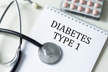 types 1 Diabetes. text on white paper in notebook near stethoscope