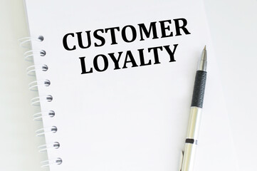 Customer Loyalty text written on a notebook
