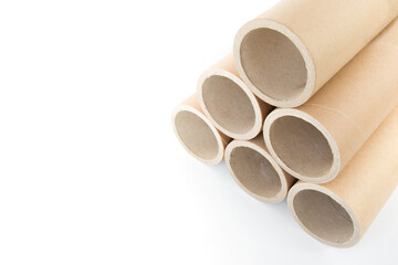 Pressed paper cylindrical tubes, on an isolated white background