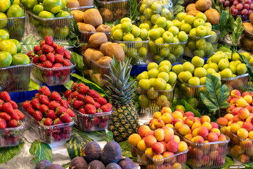 Fruit and vegetable market counter. Fresh a variety of fruits lie on the counter in the store.