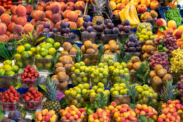 Fruit and vegetable market counter. Fresh a variety of fruits lie on the counter in the store.