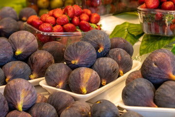 Figs on the market counter. Pile of ripe figs