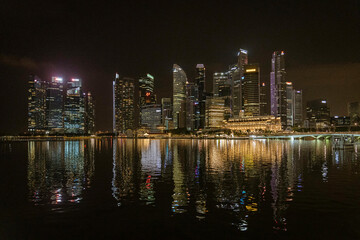 Singapore, July 24, 2022 - Bay at night with reflections on water.