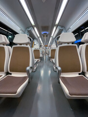 Fototapeta premium empty train car seats, train mode of transportation