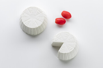 cottage cheese with cherry tomatoes on a white background