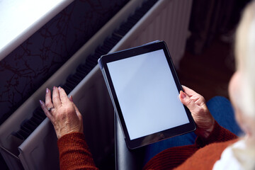 Senior Woman In Wheelchair Reviews Online Account On Digital Tablet In Cost Of Living Energy Crisis