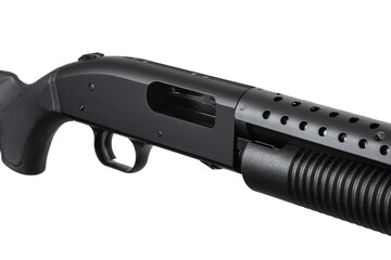 Pump-action 12 gauge shotgun isolated on a white back. Close-up shot of part of a shotgun. A...