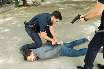 Police agents arresting a criminal suspect