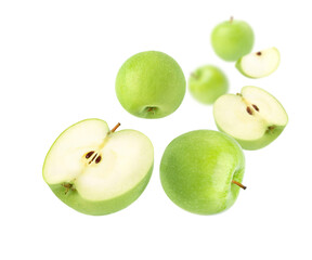 Green apples with cut in half levitated  isolated on white background.