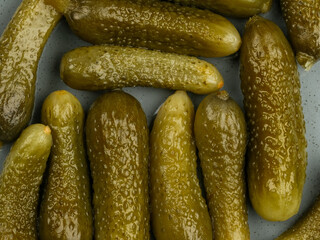 Top view of pickled cucumbers on the table