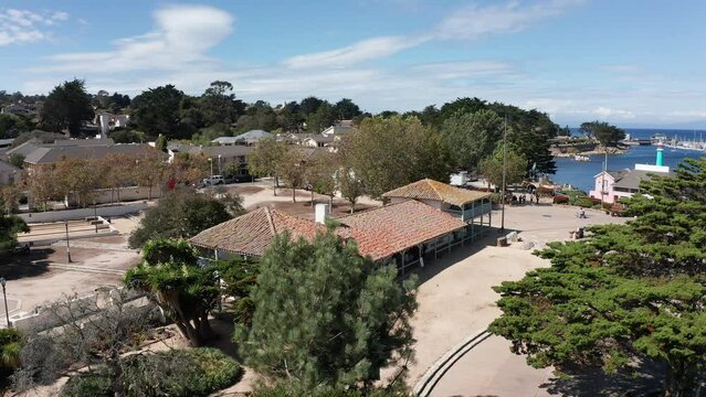Low close-up aerial shot of the historic Spanish-style Custom House in Monterey, California. 4K