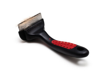 comb for combing wool from animals on a white background