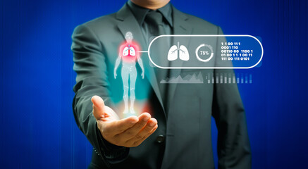 Businessman showing virtual hologram of human lungs in his hand, analysis of human organ with x-ray scanner, Hi-tech technology and medicine of the future concept