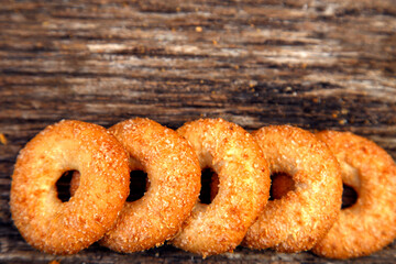 Fresh homemade biscuits in stock. Sweet cookies on a wooden table. Dessert sweet biscuits for tea and coffee. Concept of yummy, cookies, desserts.