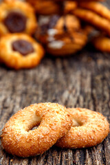 Fresh homemade biscuits in stock. Sweet cookies on a wooden table. Dessert sweet biscuits for tea and coffee. Concept of yummy, cookies, desserts.