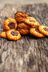 Fresh homemade biscuits in stock. Sweet cookies on a wooden table. Dessert sweet biscuits for tea and coffee. Concept of yummy, cookies, desserts.
