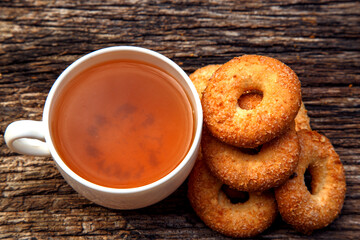 Homemade sweet cookies with tea. Delicious sweet cookies with tea on the table. Dessert cookies with tea in a cafe. The concept of desserts, sweets, coffee shop.