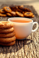 Homemade sweet cookies with tea. Delicious sweet cookies with tea on the table. Dessert cookies with tea in a cafe. The concept of desserts, sweets, coffee shop.