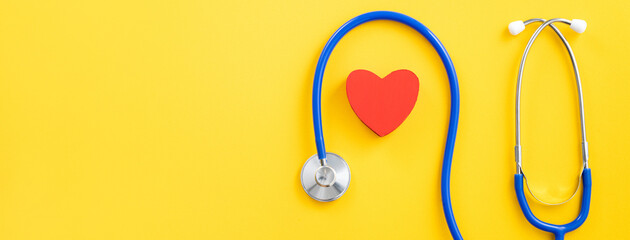 Blue stethoscope with red heart, medical care design concept.