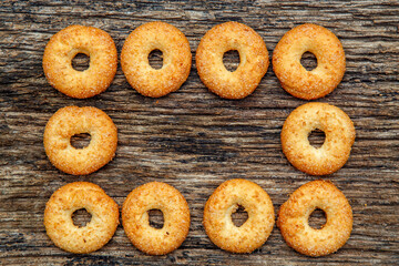 Fresh homemade biscuits in stock. Sweet cookies on a wooden table. Dessert sweet biscuits for tea and coffee. Concept of yummy, cookies, desserts.