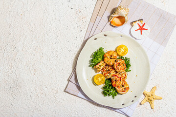 Grilled shrimp salad with lettuce, tomato cherries and spices on a plate. Fresh and healthy seafood