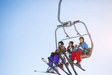 Girl on ski lift high in the mountains