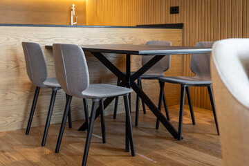 Modern dining table with chairs in luxury apartment