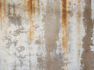 The surface of the cement wall with paint stains from prolonged washing by water