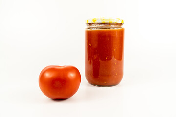 Tomato sauce in a jar. Homemade tomato sauce making process concept idea on white background.