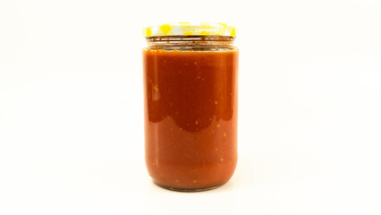 Tomato sauce in a jar. Homemade tomato sauce making process concept idea on white background.