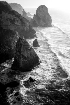 View of the rocks on the Atlantic coast of Portugal. Black and white photo.