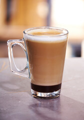 cup of latte on wooden table