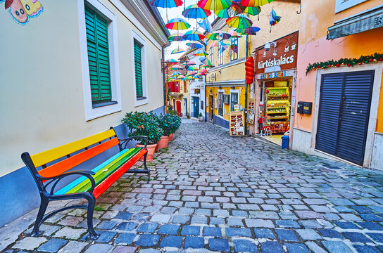 The rainbow bench and umbrellas over the street, on Feb 24 in Szentendre