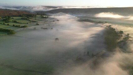 Inversion flog behaving like waves on a beach - aerial time-lapse. Location North York Moors in England