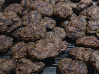 fried fresh meatballs in a pan