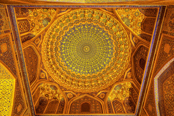Fototapeta na wymiar The dome of the mosque in the Tillya-Kari Madrasah on Registan Square, Samarkand, Uzbekistan
