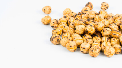 Roasted chickpea. Group of roasted chickpeas isolated on white background. selective focus. Leblebi in Turkish.