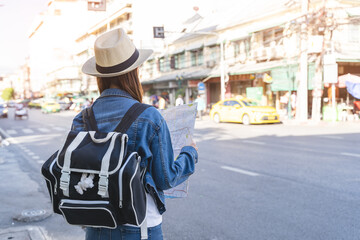Backpacker journey destination concept, Young tourism student traveling city tour at market street...