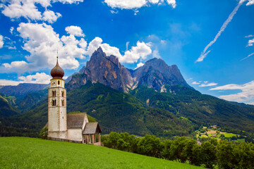 Fototapeta premium St Valentine's Church, Seis am Schlern, Italy, with the Impressive Mountain Schlern in the Background