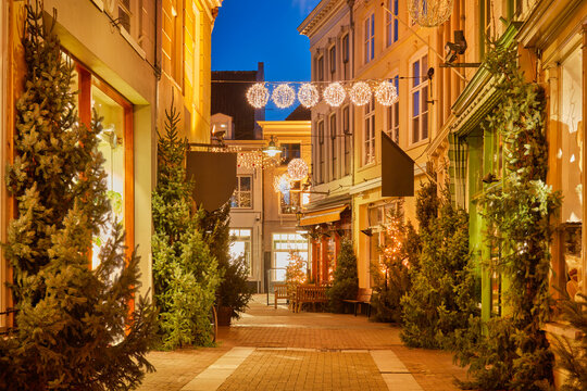 The pitoresque Dutch shopping street Ridderstraat with december christmas decoration in Den Bosch, The Netherlands
