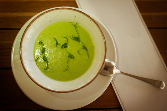 Brocali puree soup shot from above. Diet vegetarian food for lunch.