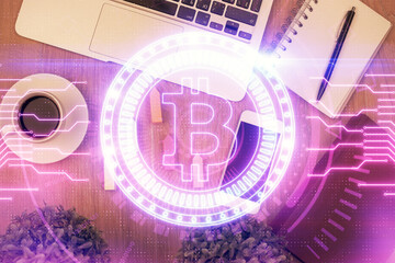 Double exposure of blockchain theme hologram over table with phone. Top view. Crypto technology...