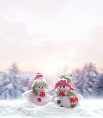 Merry Christmas and happy New Year greeting card with copy space.Two snowmen standing in snow. Christmas landscape. Winter background.