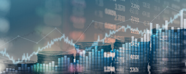 Double exposure of financial chart with line graph in stock market and stack of coins background