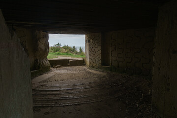 Fototapeta na wymiar Inside an empty german bunker of the Second World War, remains of the Atlantic Wall at Omaha Beach, Normandy, France