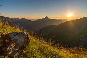 Stunning sunset hike from the top in the austria mountain