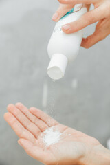 Cosmetologist pour the powder into the palm of your hand. skin care. powder for hair removal.