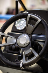 Steering wheel and dashboard of a motor boat.