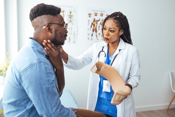 Man with cervical neck collar at doctor office, asking for help and being in pain. Patient with...