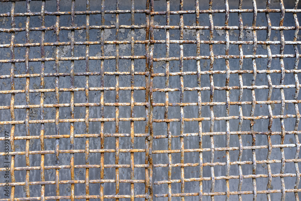 Poster old rusty grille on the windows